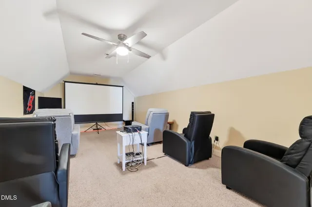 a view of a house with backyard and tree