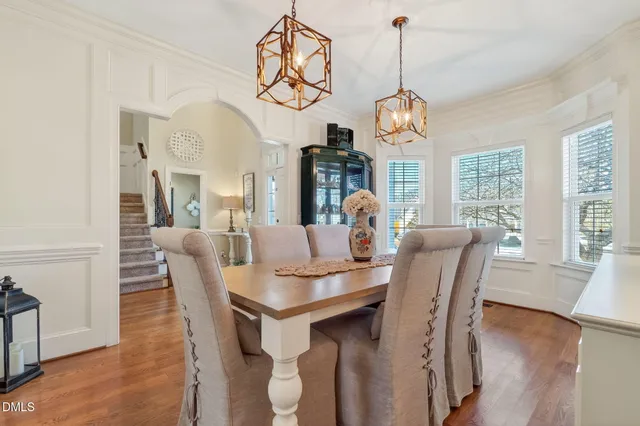 a kitchen with stainless steel appliances granite countertop a refrigerator a stove and a wooden cabinets