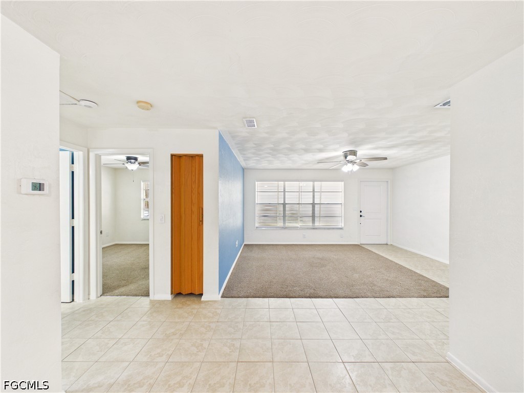18541 Iris Road Fort Myers, FL 33967 - Photo 13 of 18 an empty room with windows and cabinet
