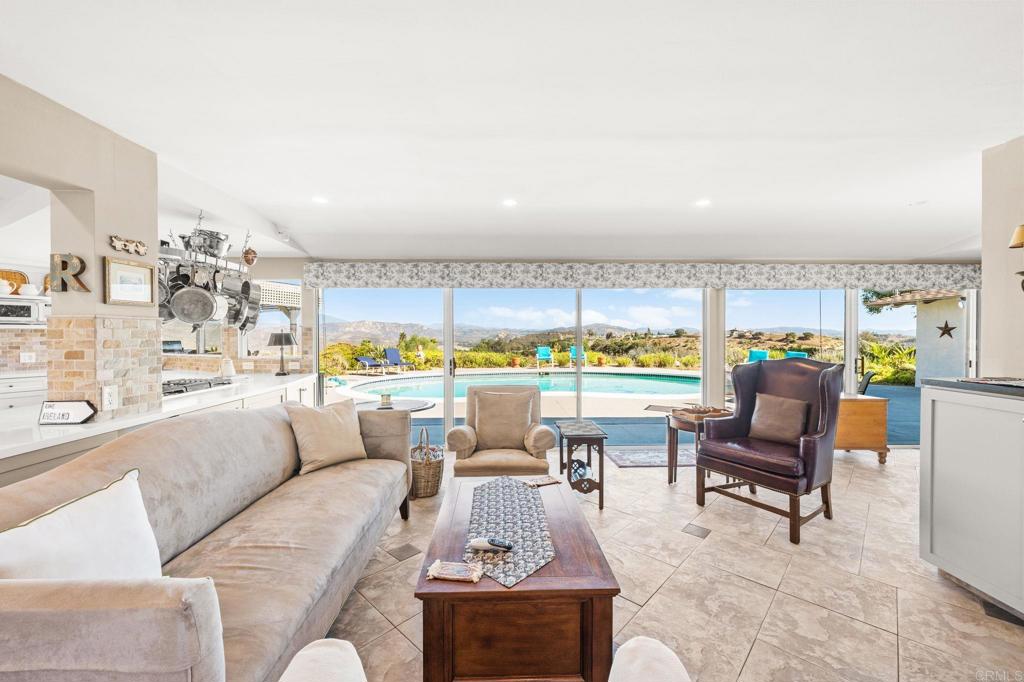 3730 Poppy Lane Fallbrook, CA 92028 - Photo 29 of 75 a living room with furniture and a large window