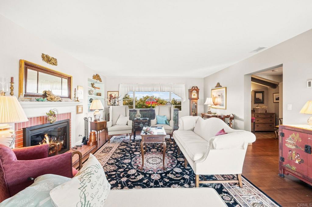 3730 Poppy Lane Fallbrook, CA 92028 - Photo 35 of 75 a living room with furniture a fireplace and a flat screen tv