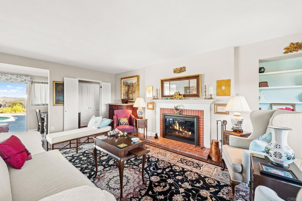 3730 Poppy Lane Fallbrook, CA 92028 - Photo 37 of 75 a living room with furniture fireplace and a window
