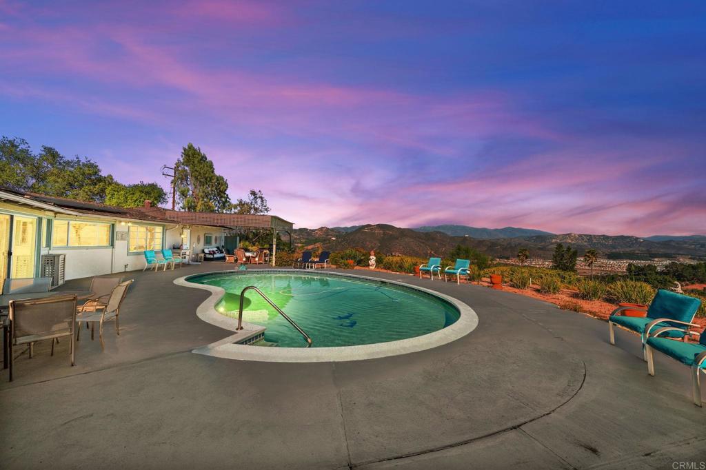 3730 Poppy Lane Fallbrook, CA 92028 - Photo 4 of 75 a view of a swimming pool with a table and chairs