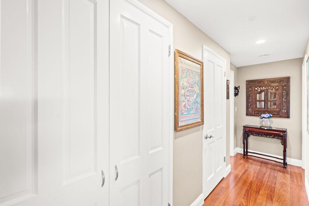 3730 Poppy Lane Fallbrook, CA 92028 - Photo 43 of 75 a view of a hardwood floor and a refrigerator in a room