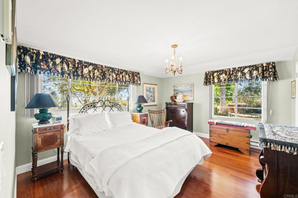 3730 Poppy Lane Fallbrook, CA 92028 - Photo 44 of 75 a bedroom with a bed mirror and a window