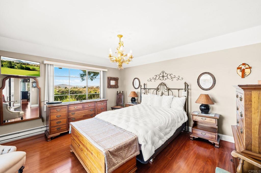 3730 Poppy Lane Fallbrook, CA 92028 - Photo 50 of 75 a bedroom with a bed and a chandelier