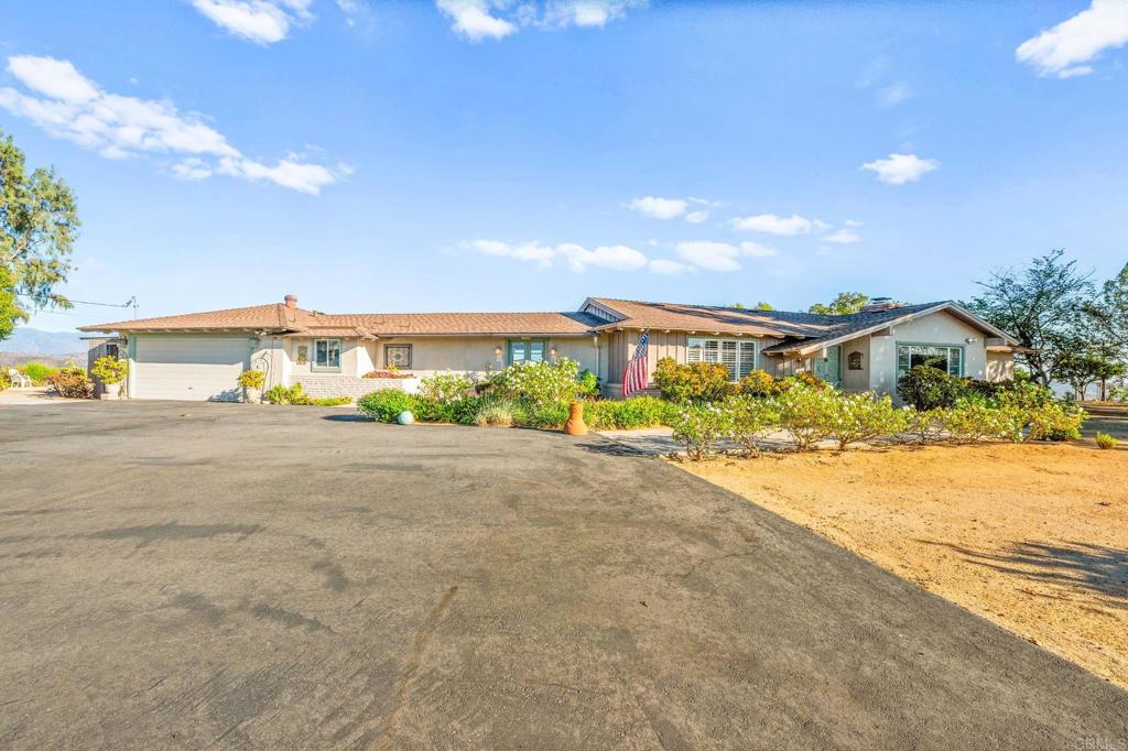 3730 Poppy Lane Fallbrook, CA 92028 - Photo 6 of 75 a view of an house with backyard and bushes