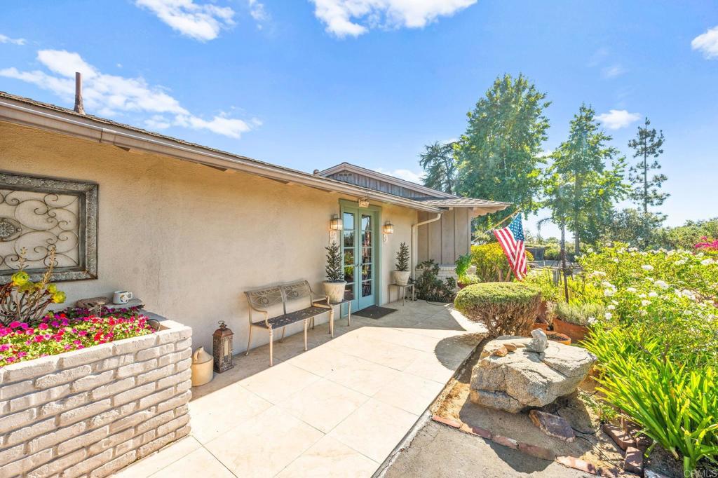 3730 Poppy Lane Fallbrook, CA 92028 - Photo 10 of 75 a view of a patio with couches table and chairs and potted plants