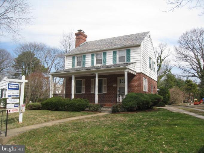 104 Cedarcroft Road Baltimore, MD 21212 - Photo 1 of 21 a front view of a house with a garden