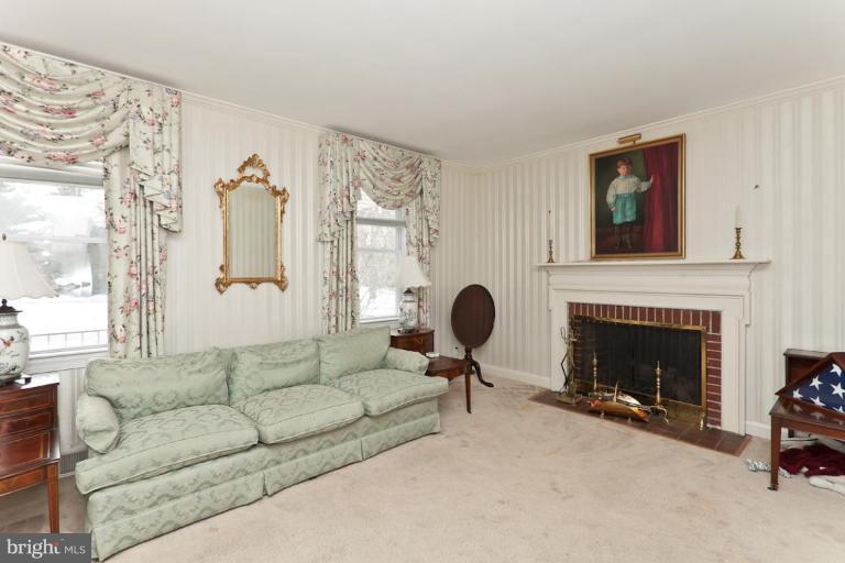 104 Cedarcroft Road Baltimore, MD 21212 - Photo 2 of 21 a living room with furniture and a fireplace