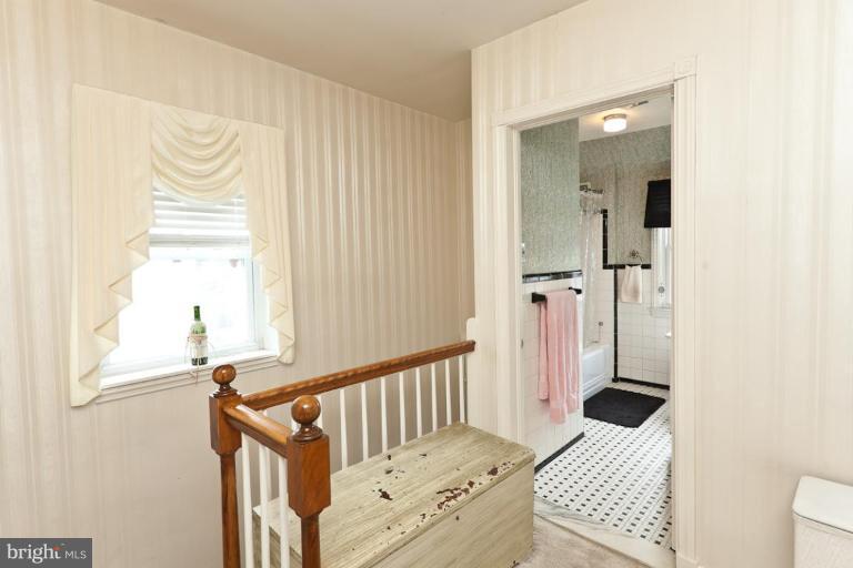 104 Cedarcroft Road Baltimore, MD 21212 - Photo 16 of 21 a bedroom with a bed and a window