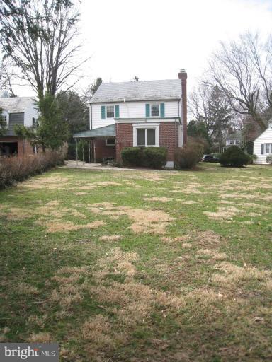 104 Cedarcroft Road Baltimore, MD 21212 - Photo 20 of 21 a front view of a house with a yard