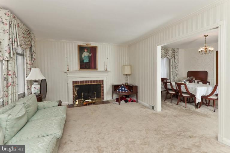 104 Cedarcroft Road Baltimore, MD 21212 - Photo 3 of 21 a living room with furniture and a fireplace
