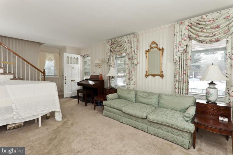 104 Cedarcroft Road Baltimore, MD 21212 - Photo 4 of 21 a living room with furniture and a large window