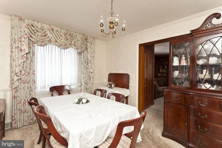104 Cedarcroft Road Baltimore, MD 21212 - Photo 5 of 21 a dining room with a table and chairs