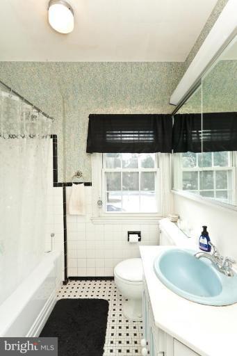 104 Cedarcroft Road Baltimore, MD 21212 - Photo 10 of 21 a bathroom with a sink toilet and shower