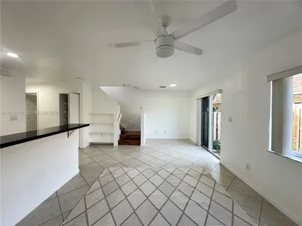 a view of a livingroom with a staircase