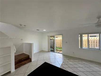 a view of kitchen with refrigerator sink and microwave