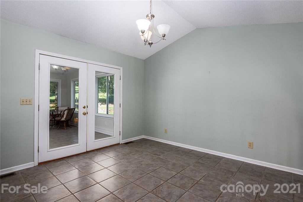 104 Rachel Street Morganton, NC 28655 - Photo 12 of 33 an empty room and chandelier fan