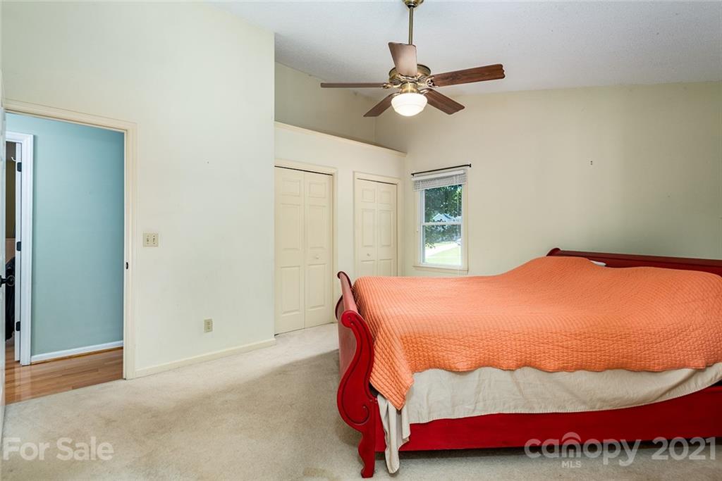 104 Rachel Street Morganton, NC 28655 - Photo 19 of 33 a bedroom with a bed and painting on the wall