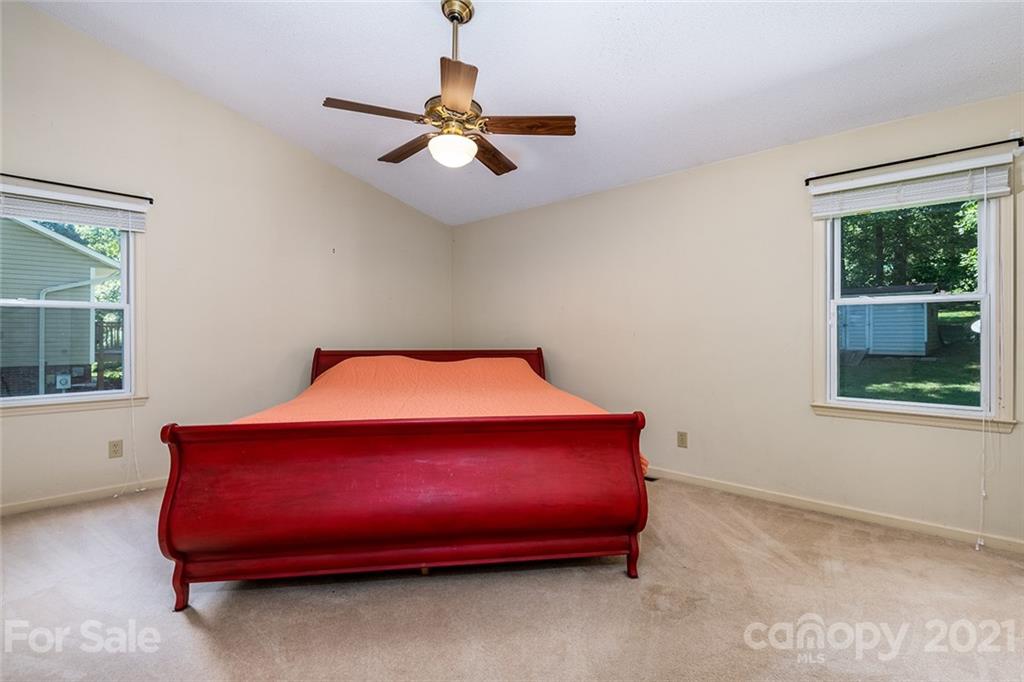104 Rachel Street Morganton, NC 28655 - Photo 20 of 33 a bed sitting in a bedroom next to a window
