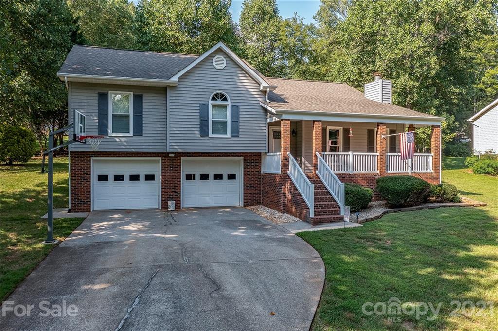 104 Rachel Street Morganton, NC 28655 - Photo 30 of 33 a front view of a house with a yard and trees