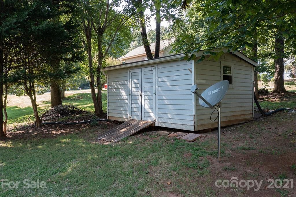 104 Rachel Street Morganton, NC 28655 - Photo 33 of 33 a view of backyard with a barn and large trees
