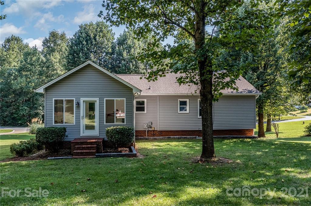 104 Rachel Street Morganton, NC 28655 - Photo 5 of 33 a view of a house with a yard and a large tree