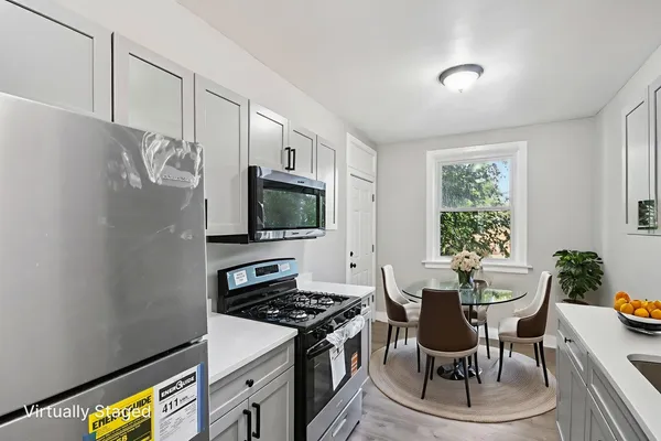 a kitchen with a stove and a microwave