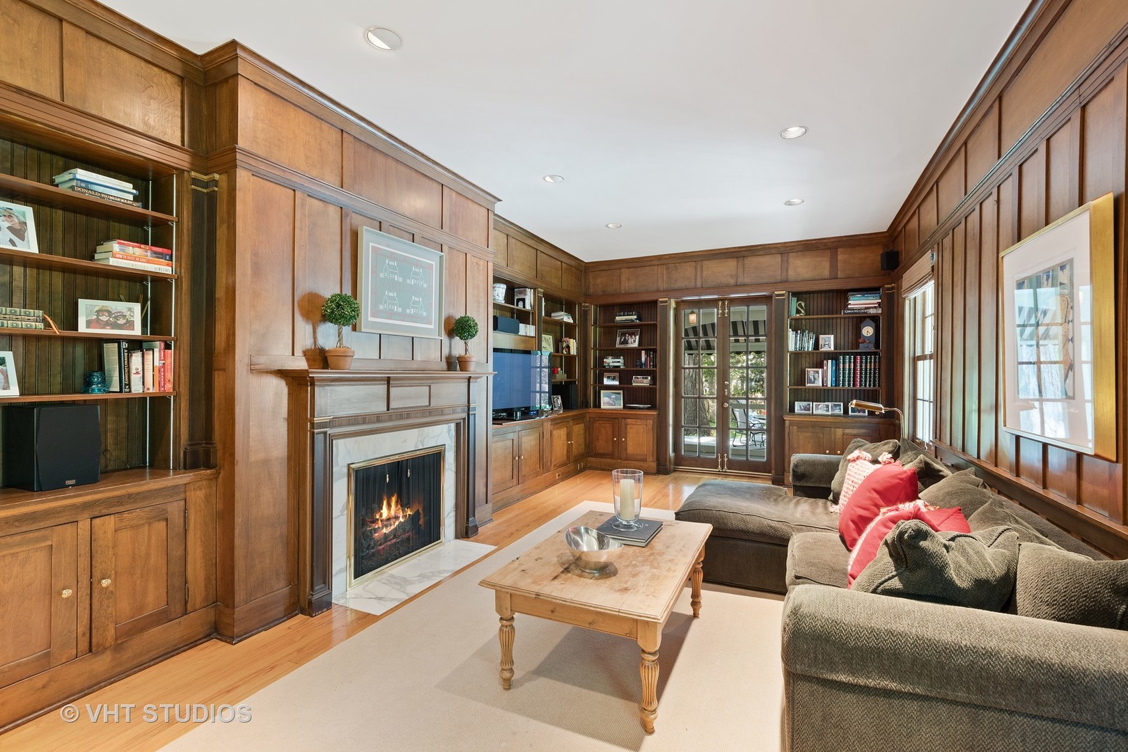 811 Sunset Road Winnetka, IL 60093 - Photo 13 of 40 a living room with furniture a fireplace and a flat screen tv