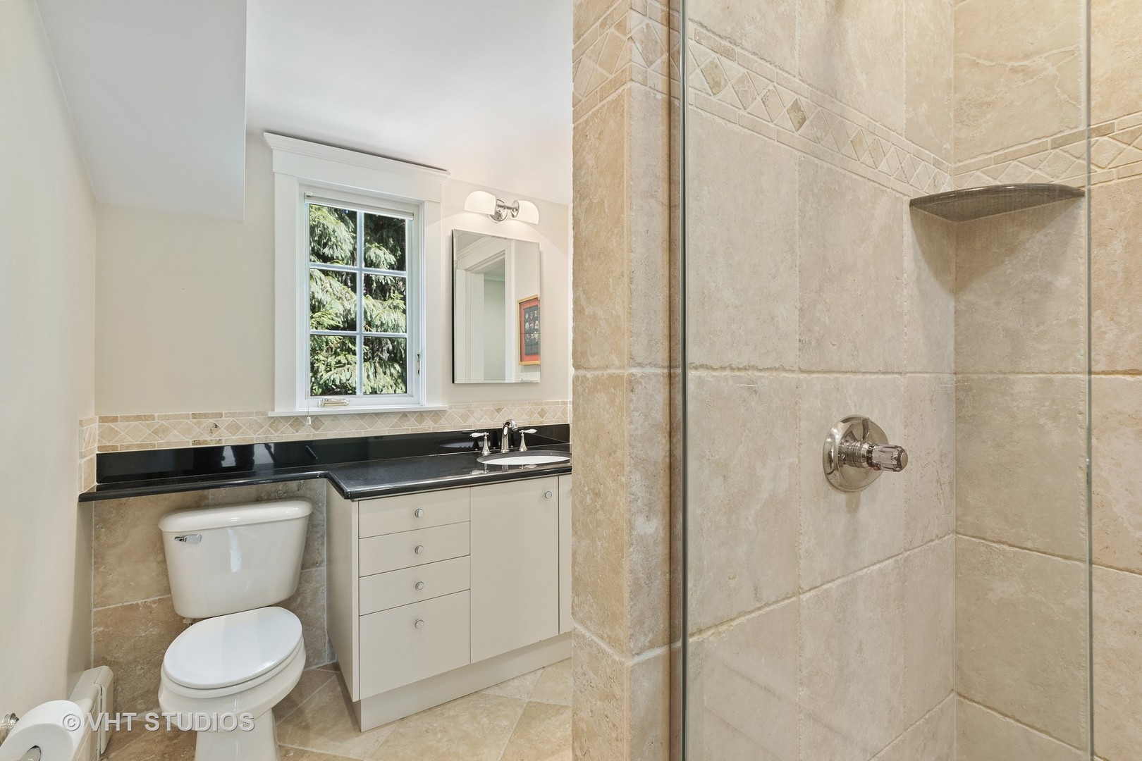 811 Sunset Road Winnetka, IL 60093 - Photo 21 of 40 a bathroom with a granite countertop toilet a sink and a mirror