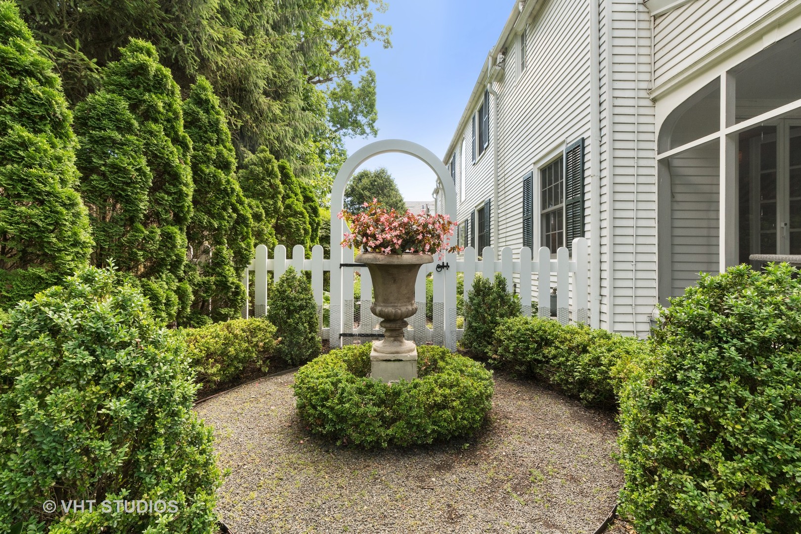 811 Sunset Road Winnetka, IL 60093 - Photo 31 of 40 a front view of a house with garden