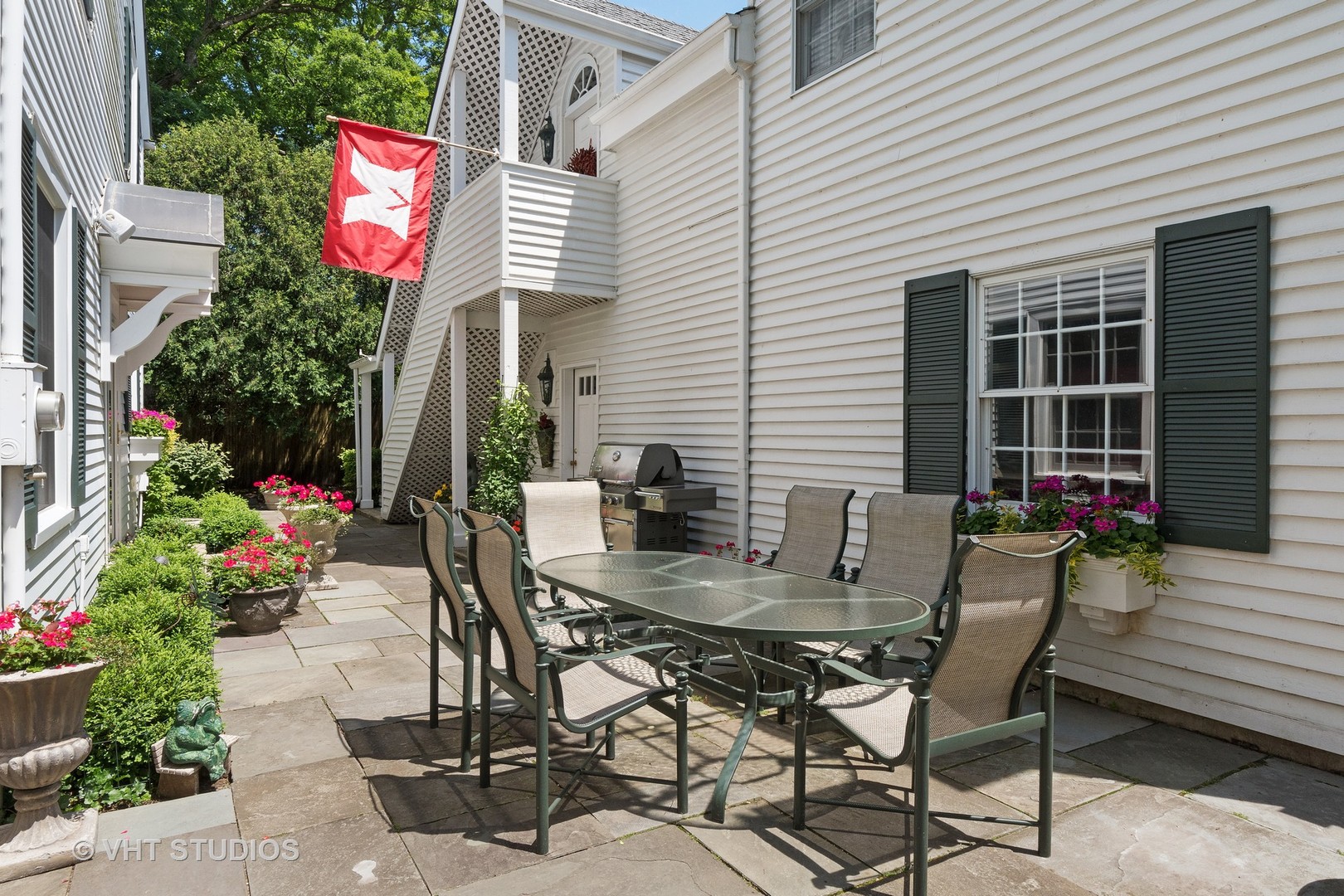 811 Sunset Road Winnetka, IL 60093 - Photo 32 of 40 a table and chairs in the patio of a house