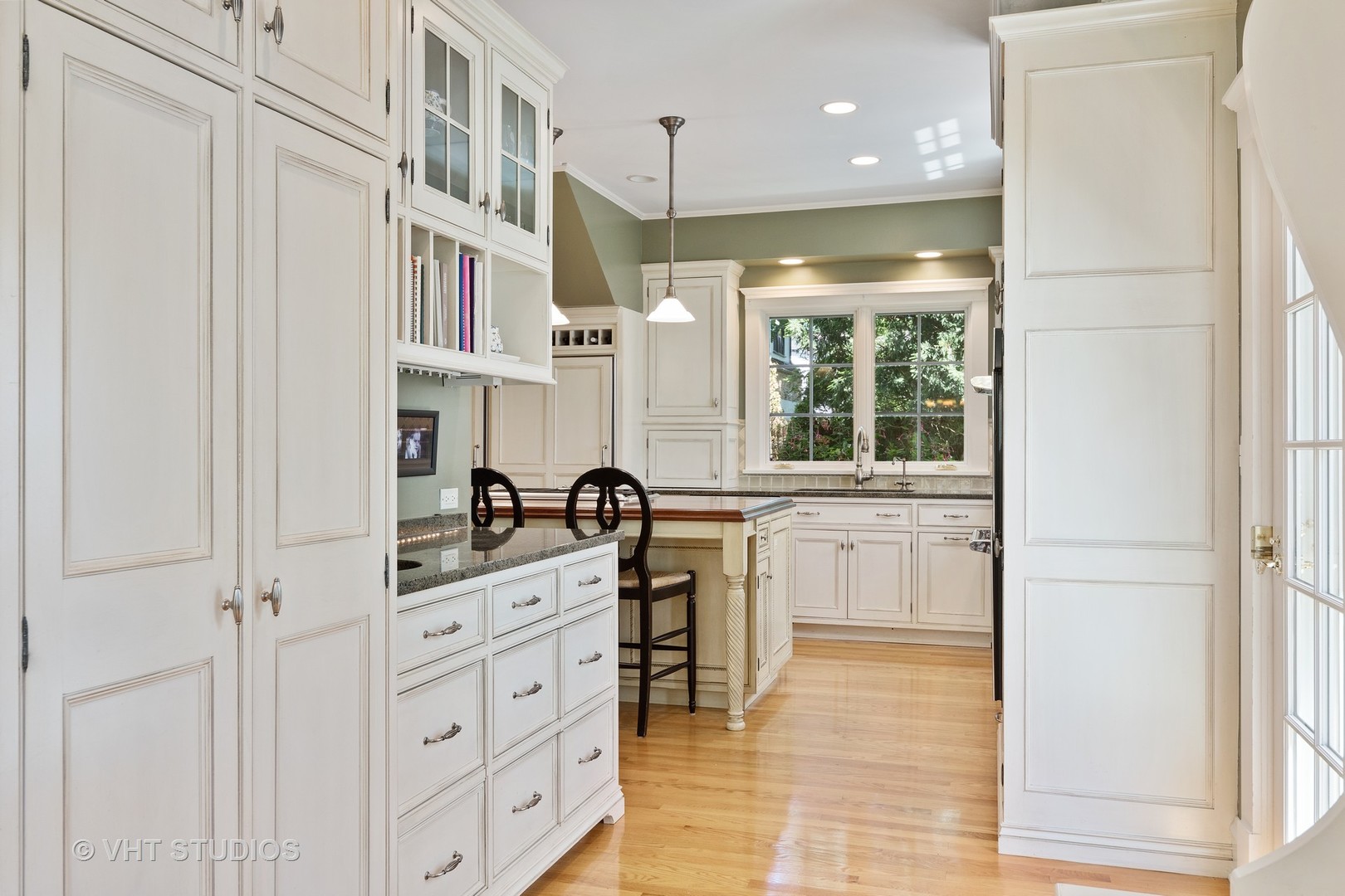 811 Sunset Road Winnetka, IL 60093 - Photo 7 of 40 a kitchen with cabinets and window