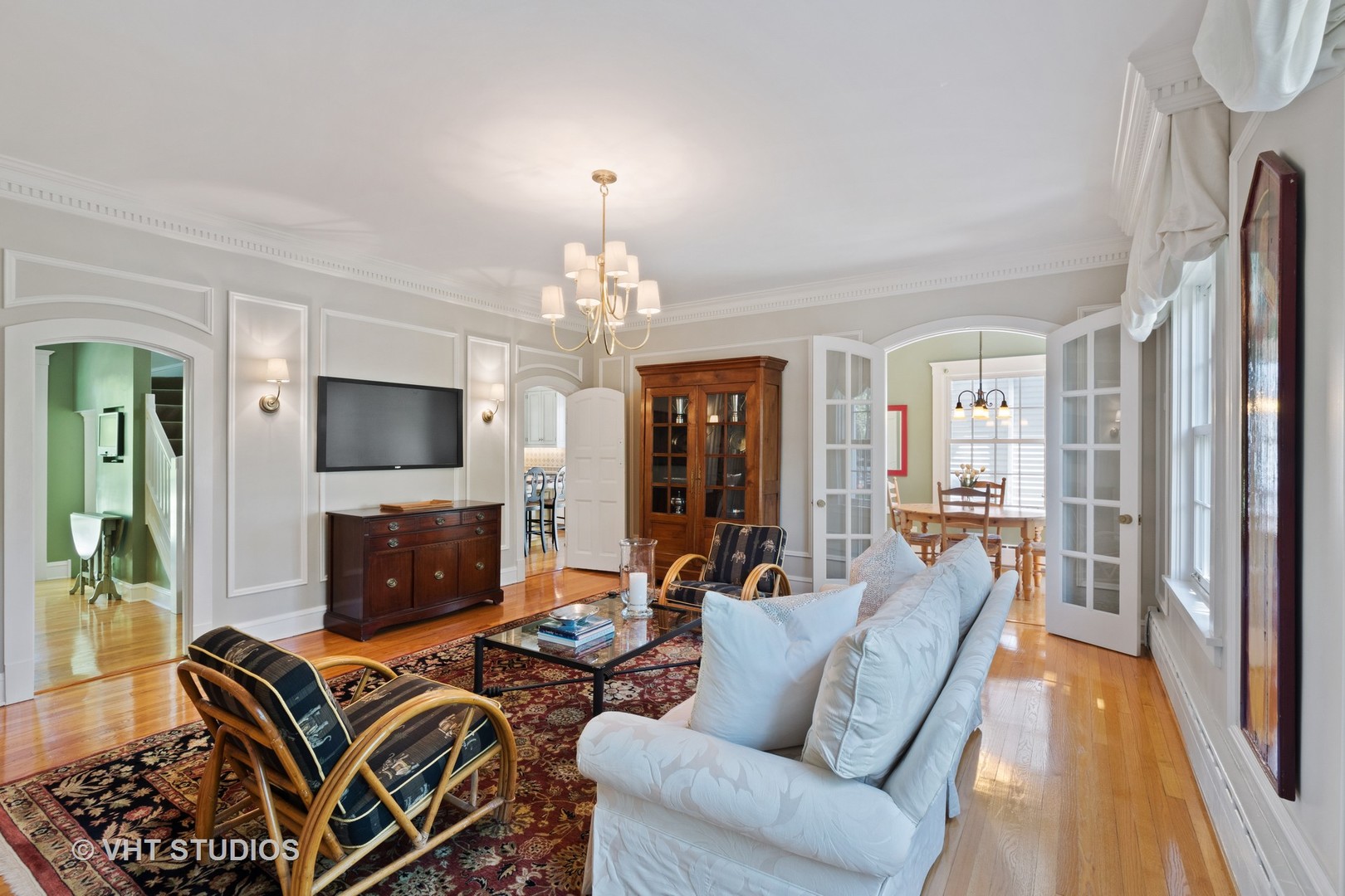811 Sunset Road Winnetka, IL 60093 - Photo 9 of 40 a living room with furniture a fireplace and a flat screen tv