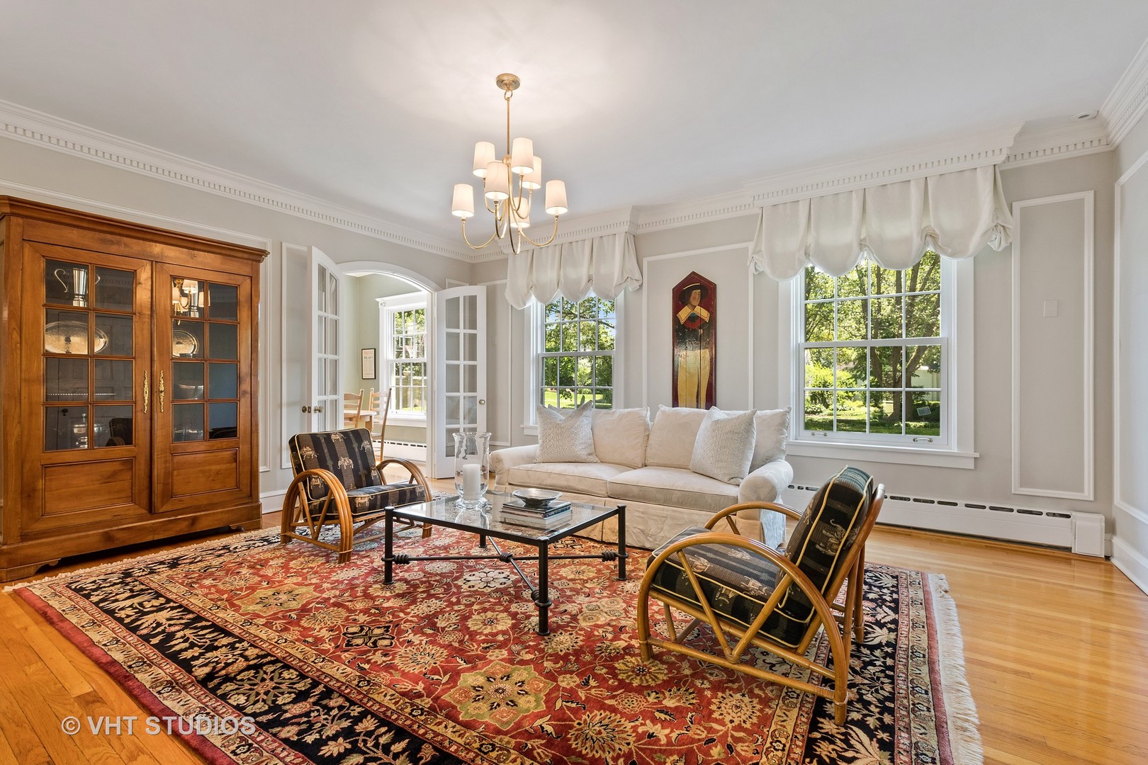 811 Sunset Road Winnetka, IL 60093 - Photo 10 of 40 a living room with furniture and a chandelier