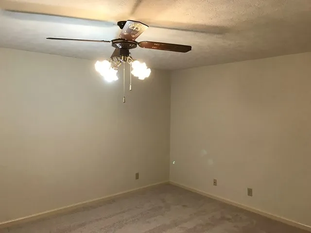a view of a small space with a fan