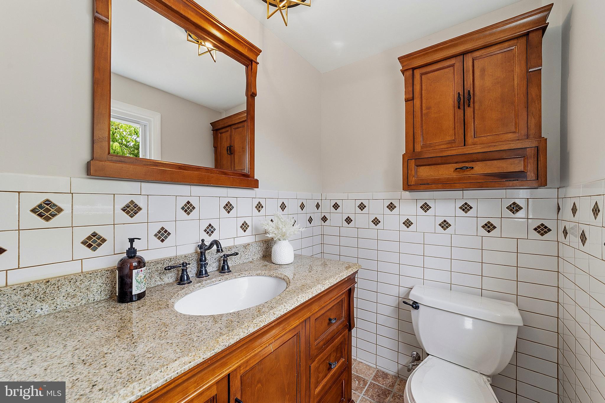 117 Harvest Road Cherry Hill, NJ 08002 - Photo 28 of 35 a bathroom with a granite countertop toilet sink and mirror