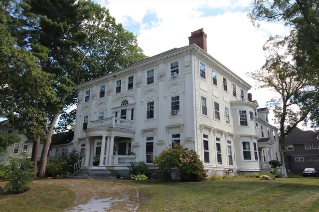 a front view of a building with garden