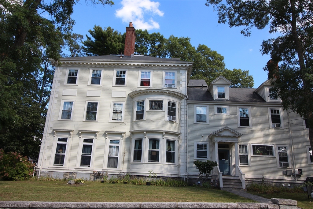16 Tyler Park, Unit 9 Lowell, MA 01851 - Photo 10 of 10 a view of house with yard and large trees