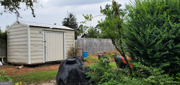 a view of a house with a yard and garage