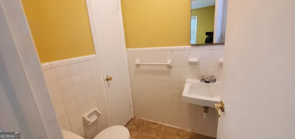a view of a bathroom from a hallway