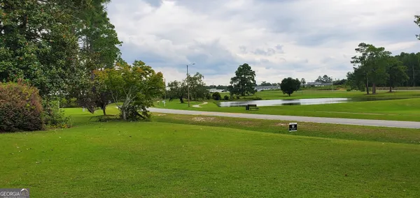a view of a golf course with a lake