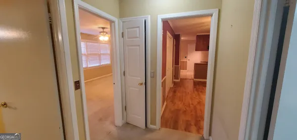 a kitchen with a wooden floor and a sink