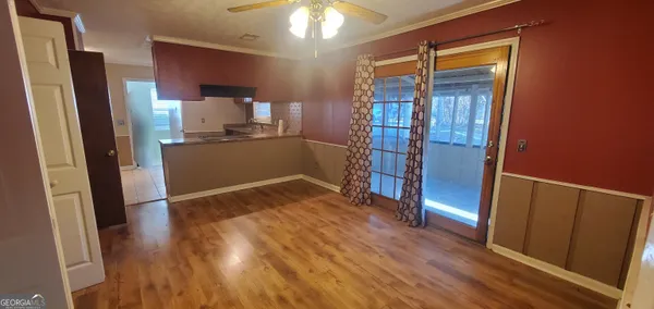 wooden floor in an empty room and a window
