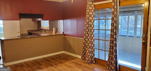 a kitchen with a refrigerator and a sink