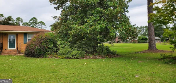 a view of a house with a garden