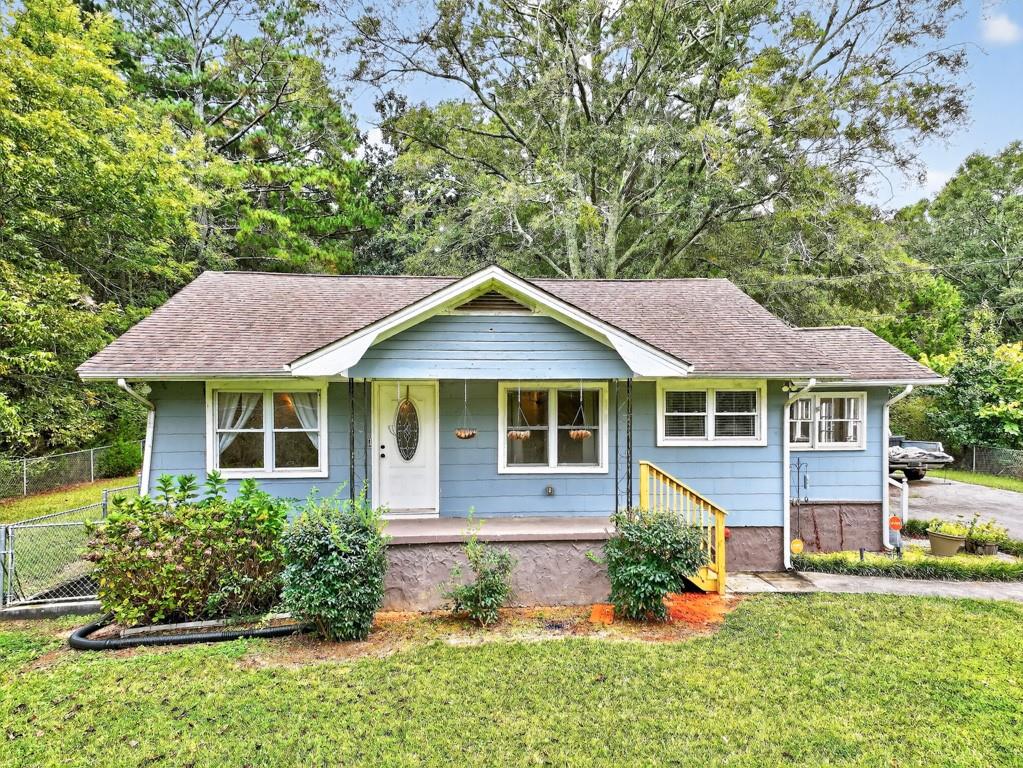 front view of a house with a yard
