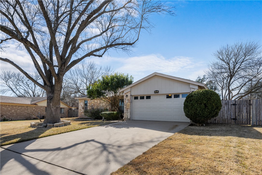 612 Middleway Road Pflugerville, TX 78660 - Photo 1 of 1 a view of a white house with a yard covered in snow