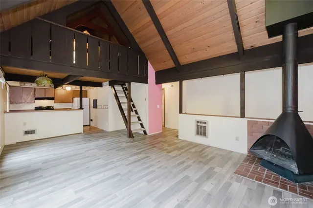 a kitchen with stainless steel appliances a refrigerator and a stove
